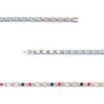 Close-up of Whisper bracelet showing light blue crystals and interlocking steel links.